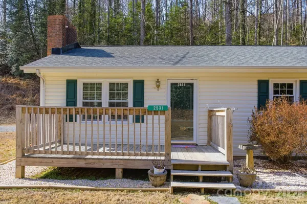 a view of a house with a small deck