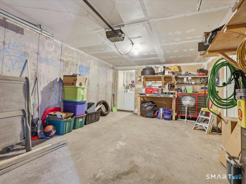 78 Woodland Ridge Meriden, CT 06450 - Photo 21 of 24 a view of a garage with rack and bicycle