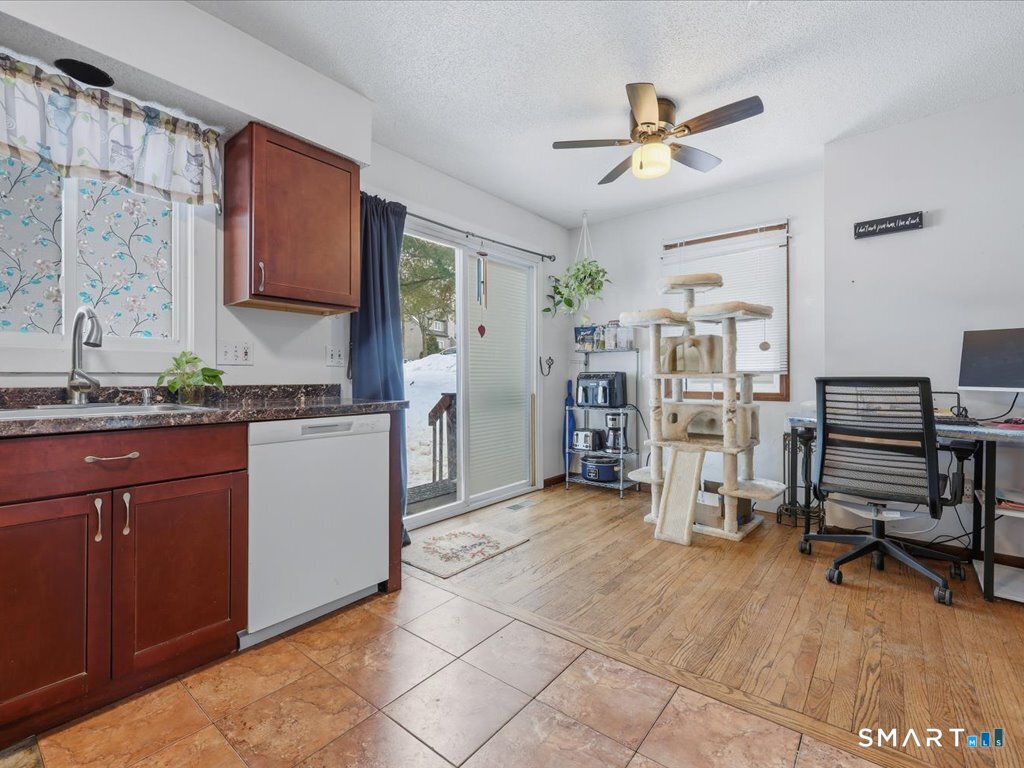 78 Woodland Ridge Meriden, CT 06450 - Photo 7 of 24 a kitchen with stainless steel appliances kitchen island granite countertop a refrigerator and a sink