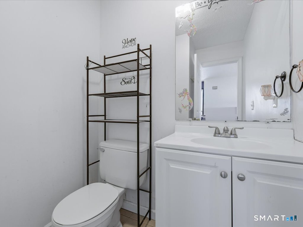 78 Woodland Ridge Meriden, CT 06450 - Photo 8 of 24 a bathroom with a sink a toilet a mirror and shower