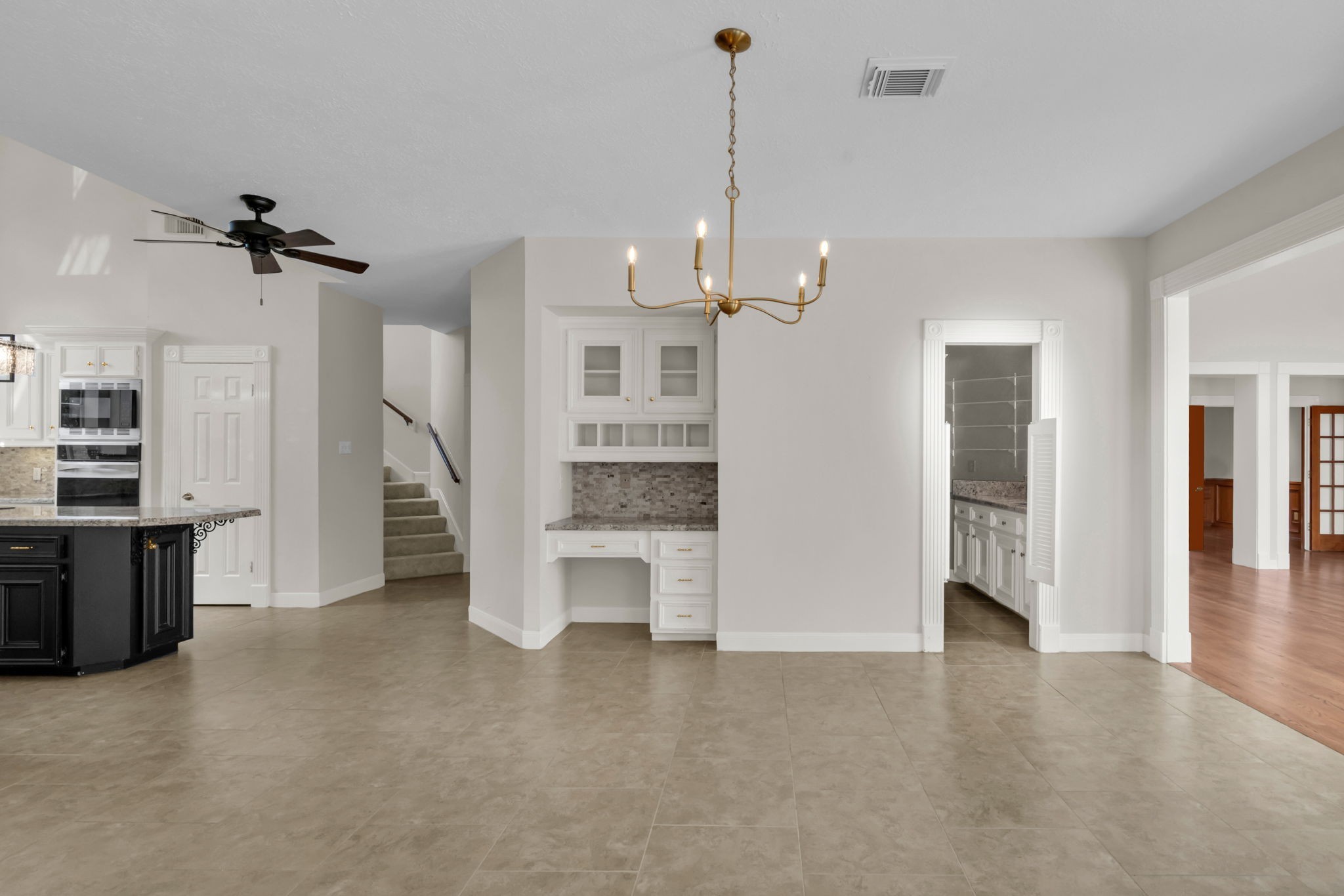 17302 Chagall Lane Spring, TX 77379 - Photo 14 of 44 Generous breakfast room with a built-in planning desk, serving station, and seamless flow to the chef's kitchen