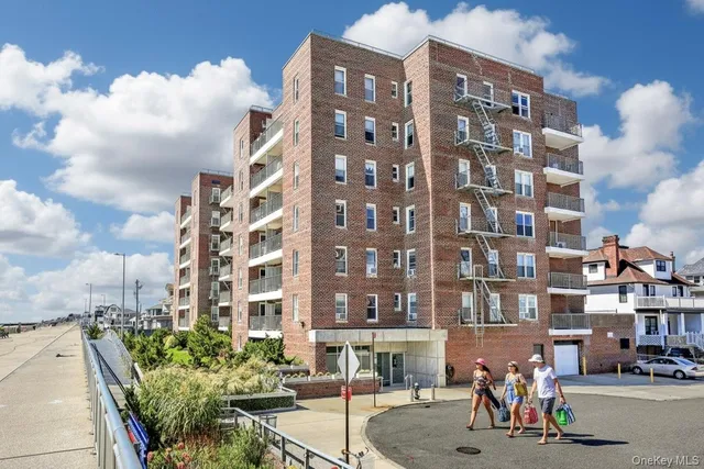 a kitchen with stainless steel appliances granite countertop a white cabinets and white appliances