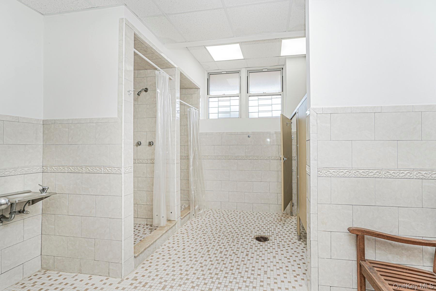 125 Beach 124th Street, Unit 6H Queens, NY 11694 - Photo 26 of 27 a bathroom with a shower
