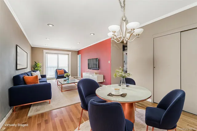 a living room with fireplace furniture and a wooden floor