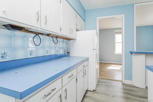 a view of cabinets and wooden floor