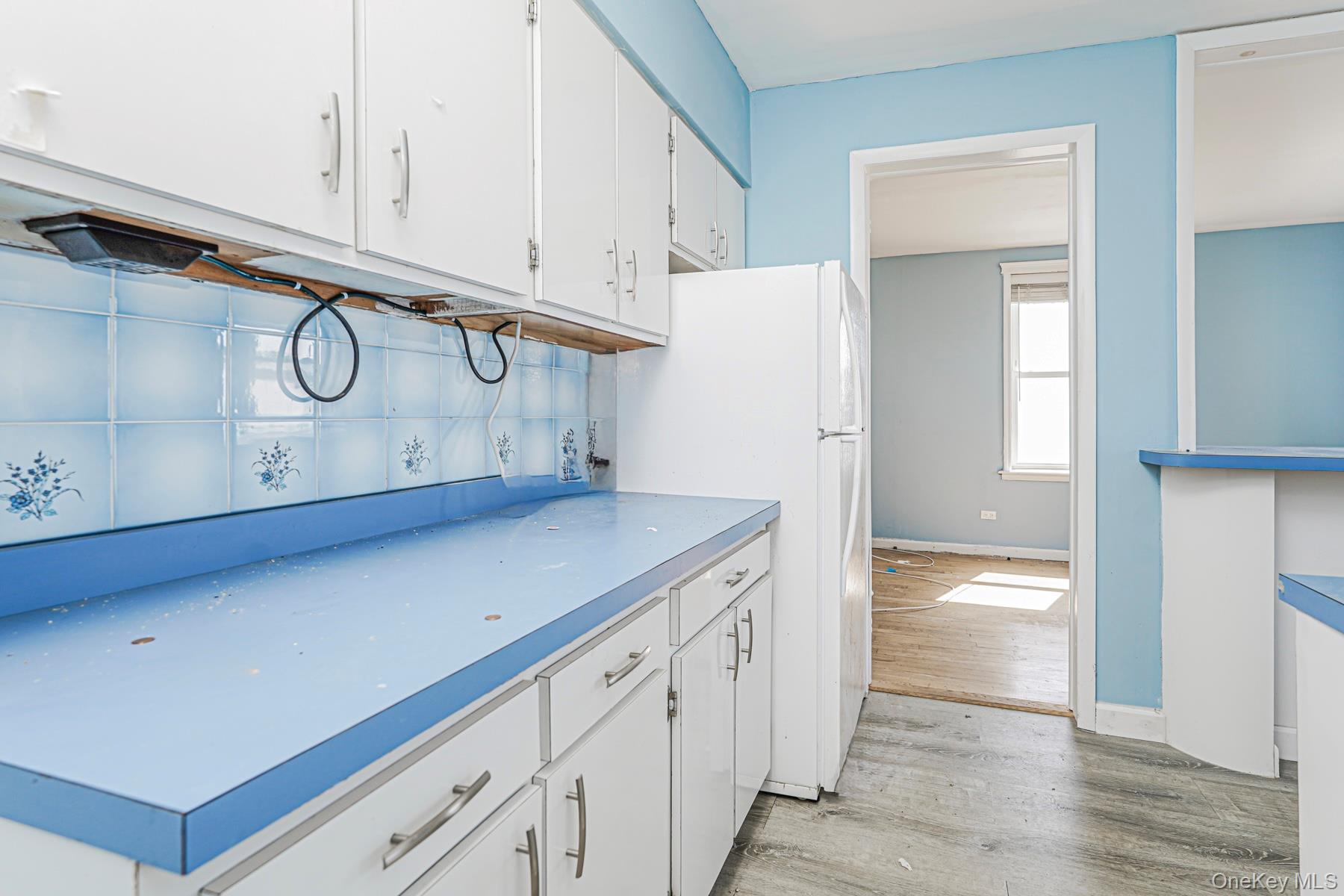 125 Beach 124th Street, Unit 6H Queens, NY 11694 - Photo 10 of 27 a view of cabinets and wooden floor