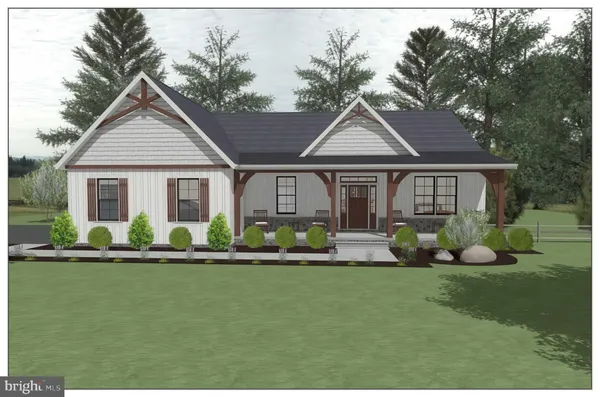 a front view of a house with a garden and yard