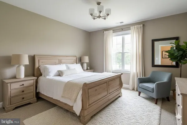a bedroom with a bed and a couch
