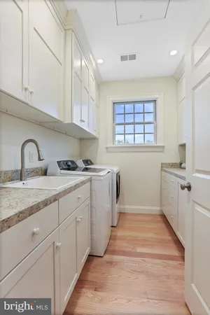 a kitchen with granite countertop a sink and cabinets