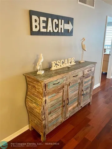 a room with a table and a potted plant