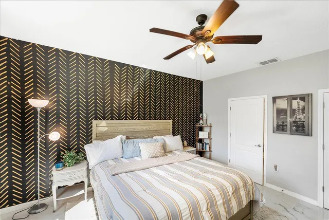 a living room with furniture and flat screen tv