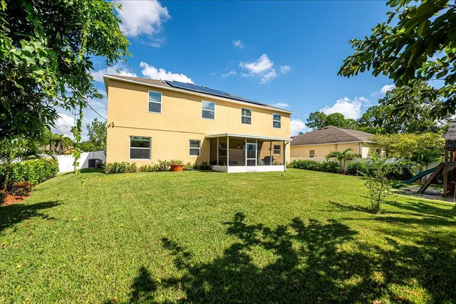 a view of a back yard of the house