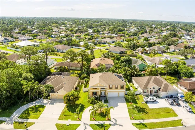 an aerial view of residential houses with outdoor space