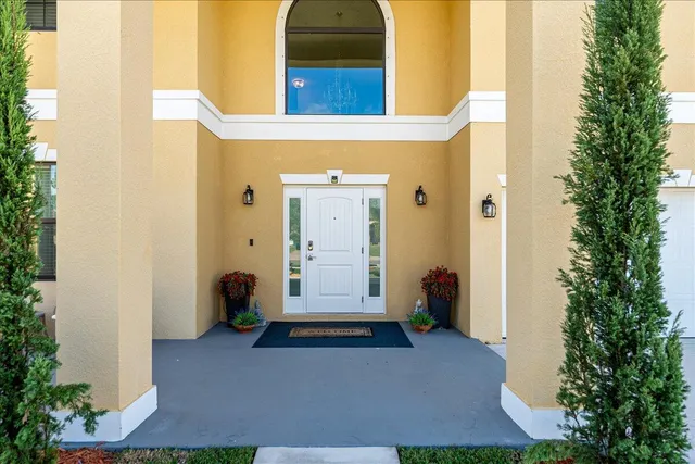 an entrance view of a house with backyard