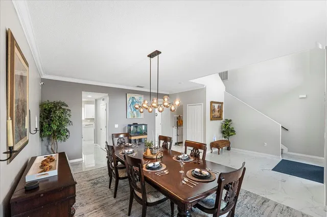 a view of a dining room with furniture and window