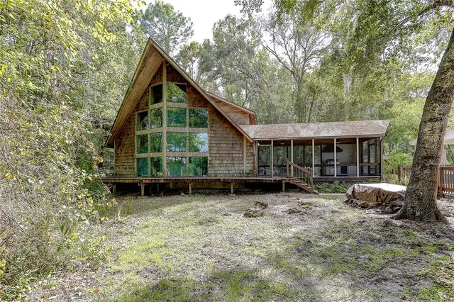 a front view of a house with a garden and porch