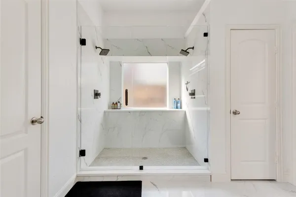 a bathroom with a bath tub