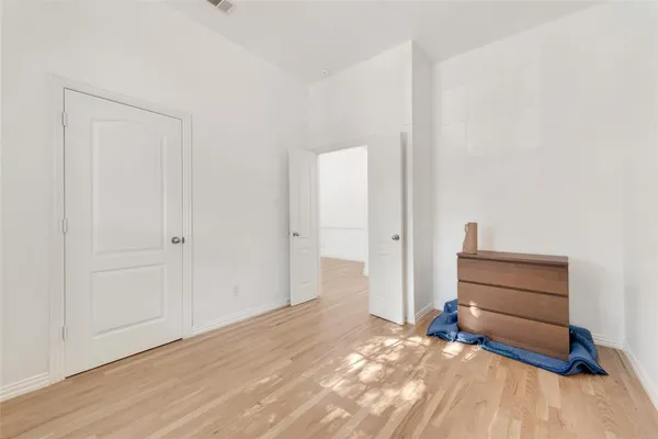 a view of room with wooden floor