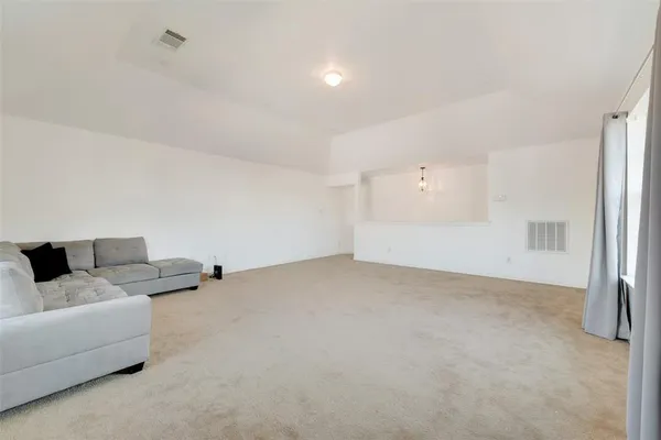 a view of livingroom with furniture and ceiling fan