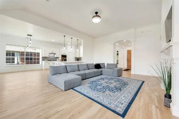 a living room with furniture and a rug
