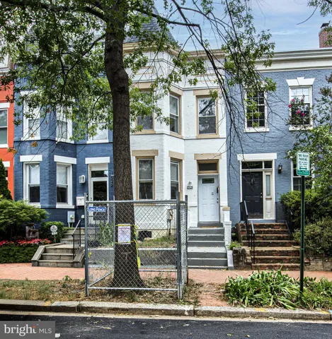 a front view of a house with street