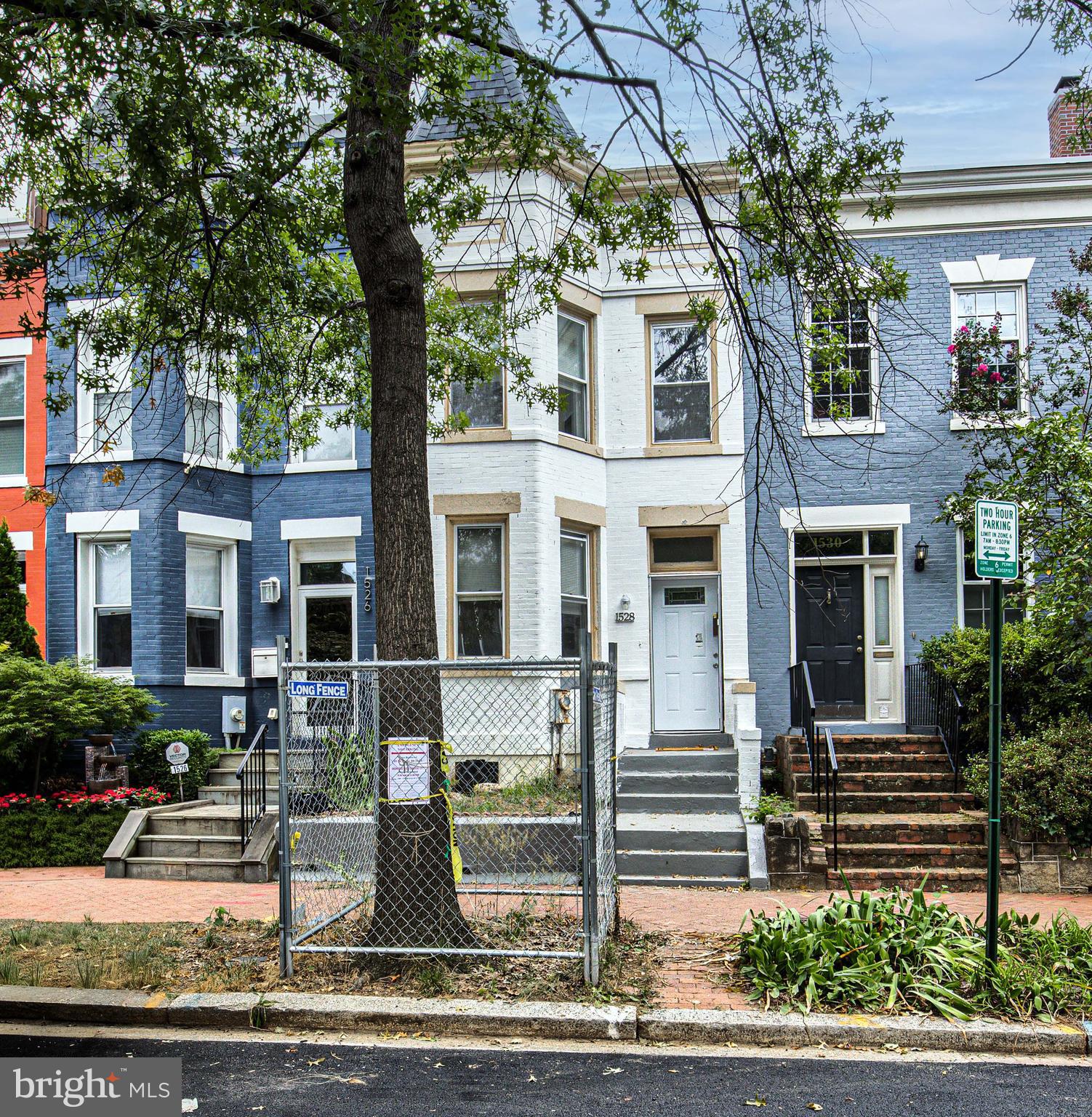 a front view of a house with street