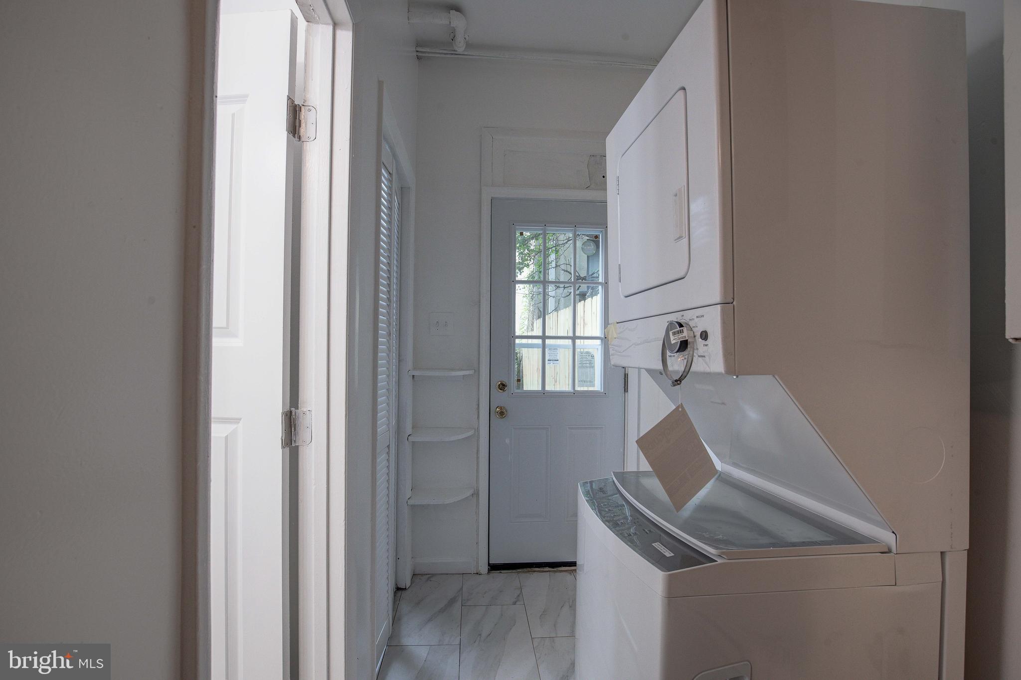 1528 E Street Southeast Washington, DC 20003 - Photo 17 of 30 a room that has a window and a wooden floor