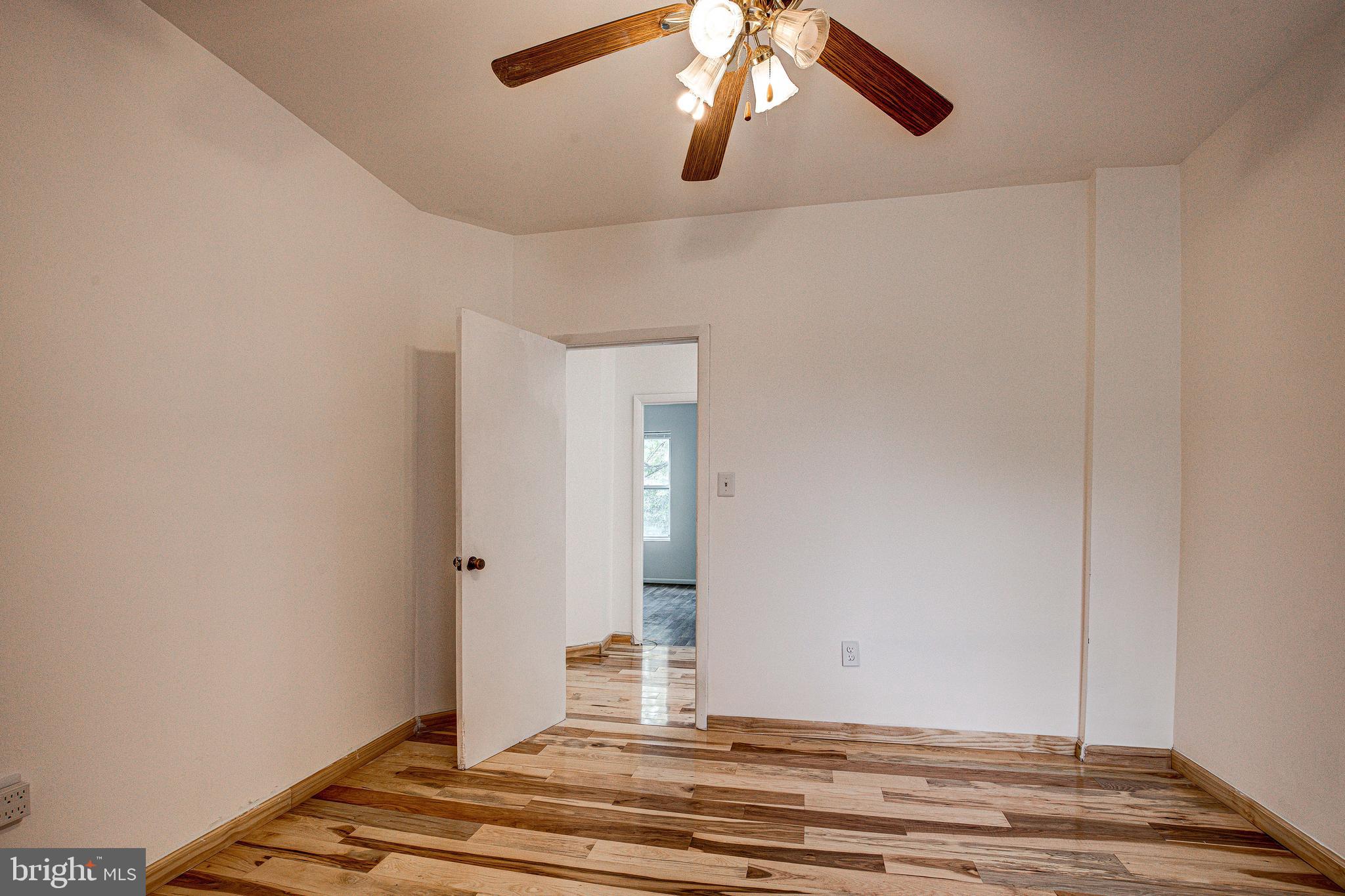 1528 E Street Southeast Washington, DC 20003 - Photo 20 of 30 a view of a livingroom with wooden floor and bedroom