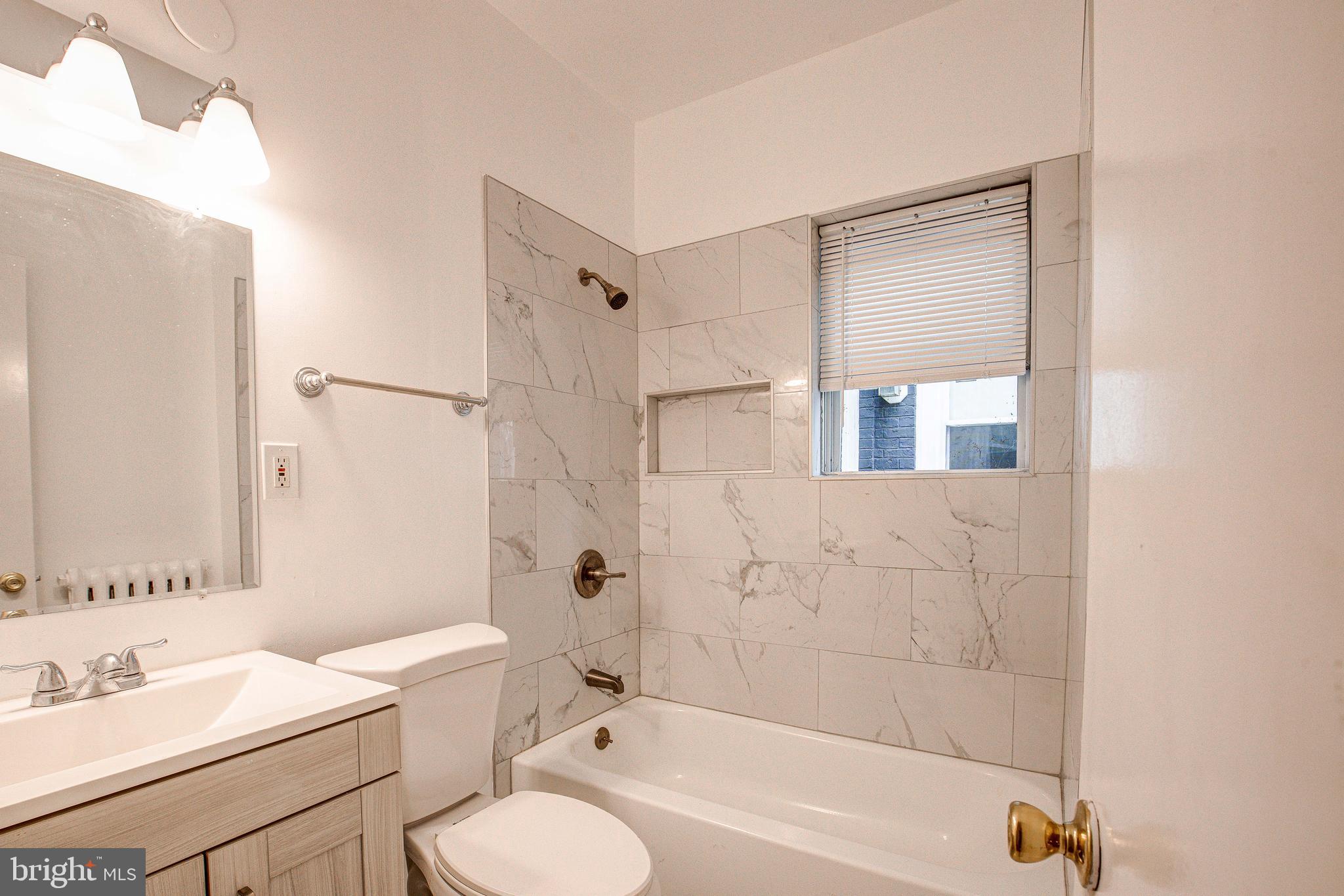 1528 E Street Southeast Washington, DC 20003 - Photo 21 of 30 a bathroom with a sink toilet tub and shower