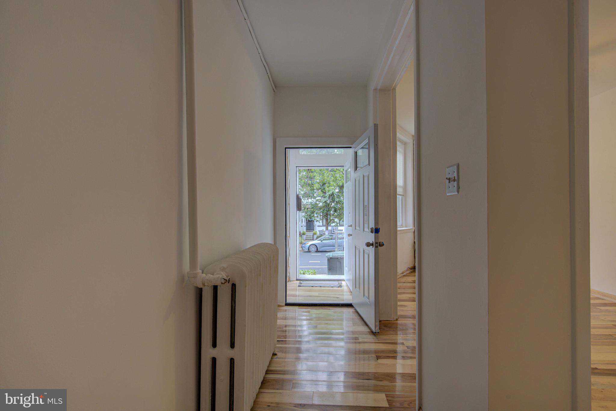 1528 E Street Southeast Washington, DC 20003 - Photo 6 of 30 a view of a hallway with wooden floor and stairs