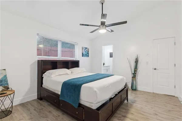 a bathroom with a sink toilet and mirror