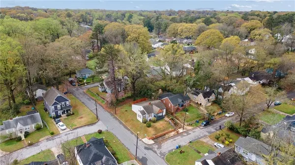 a view of a backyard with a table and chairs