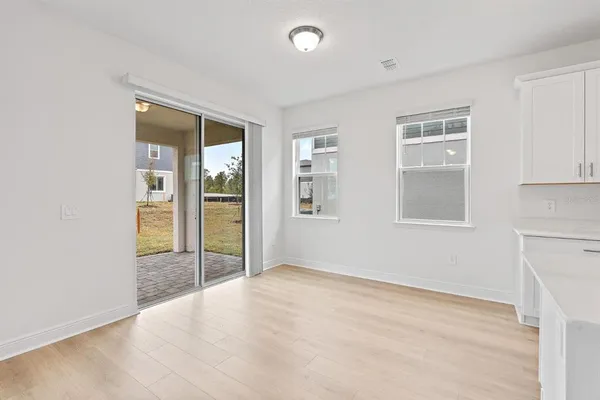 a view of an empty room with glass door