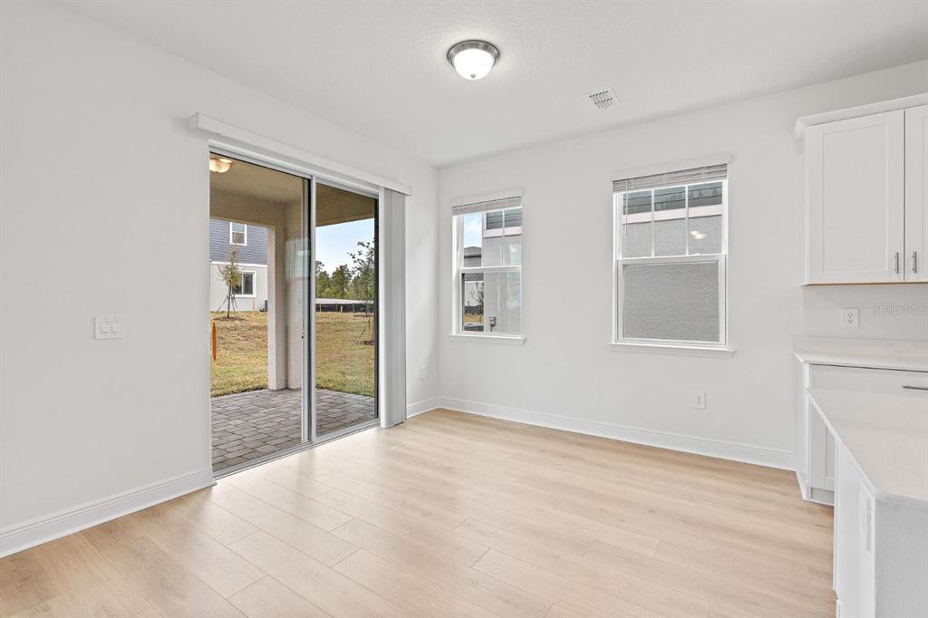 2276 Hen Road Minneola, FL 34715 - Photo 16 of 40 a view of an empty room with glass door