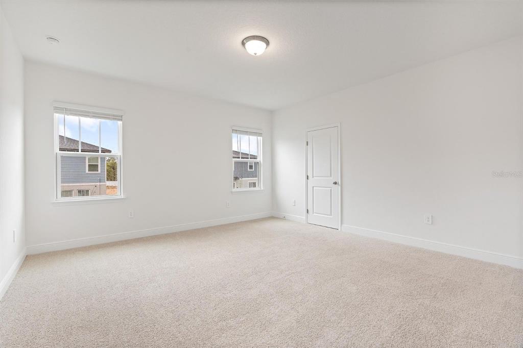 2276 Hen Road Minneola, FL 34715 - Photo 35 of 40 an empty room with windows