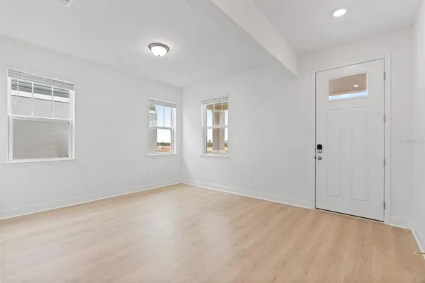 a view of an empty room with a window