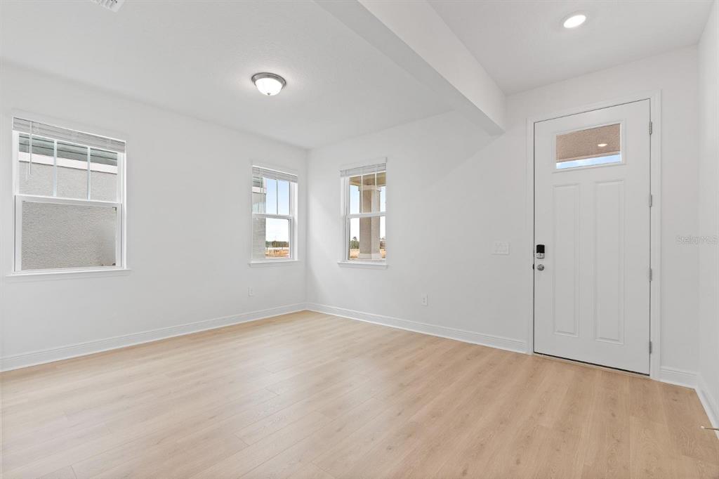 2276 Hen Road Minneola, FL 34715 - Photo 36 of 40 a view of an empty room with a window