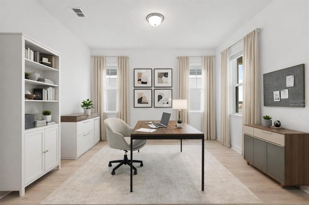 2276 Hen Road Minneola, FL 34715 - Photo 5 of 40 a view of a workspace with furniture and wooden floor