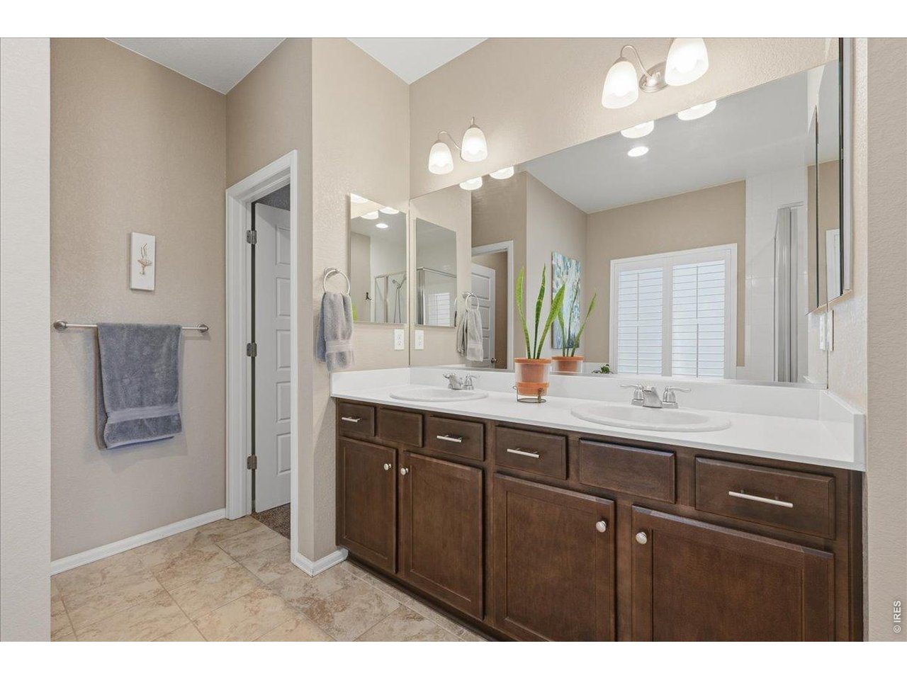 6096 Story Road Timnath, CO 80547 - Photo 23 of 50 a bathroom with a sink vanity and a mirror