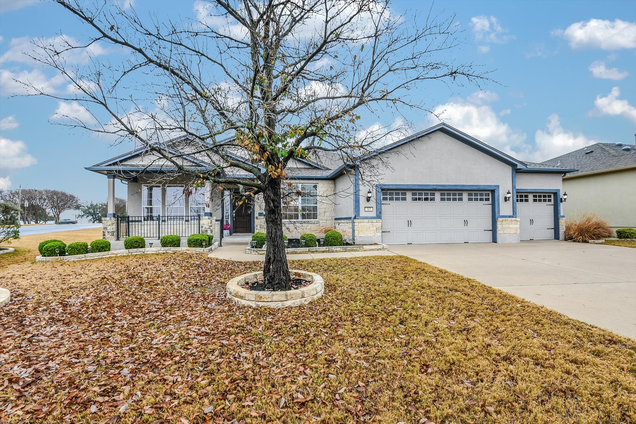 317 Yellow Rose Trail Georgetown, TX 78633 - Photo 1 of 1 a front view of a house with a yard garage and outdoor seating