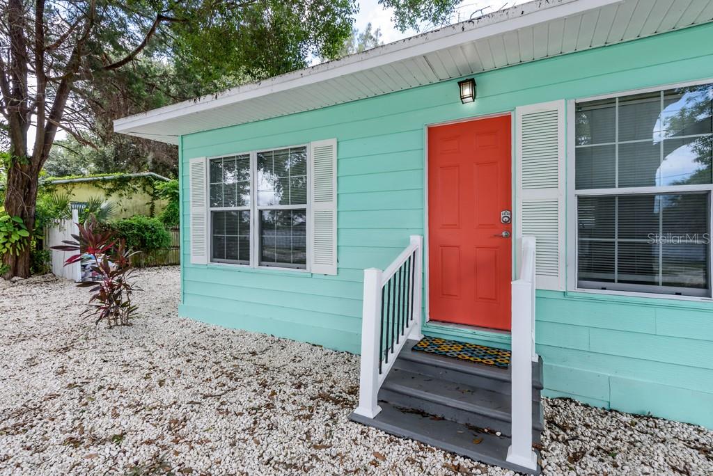 15732 Bolesta Road, Unit A Clearwater, FL 33760 - Photo 12 of 13 a front view of a house with a garden