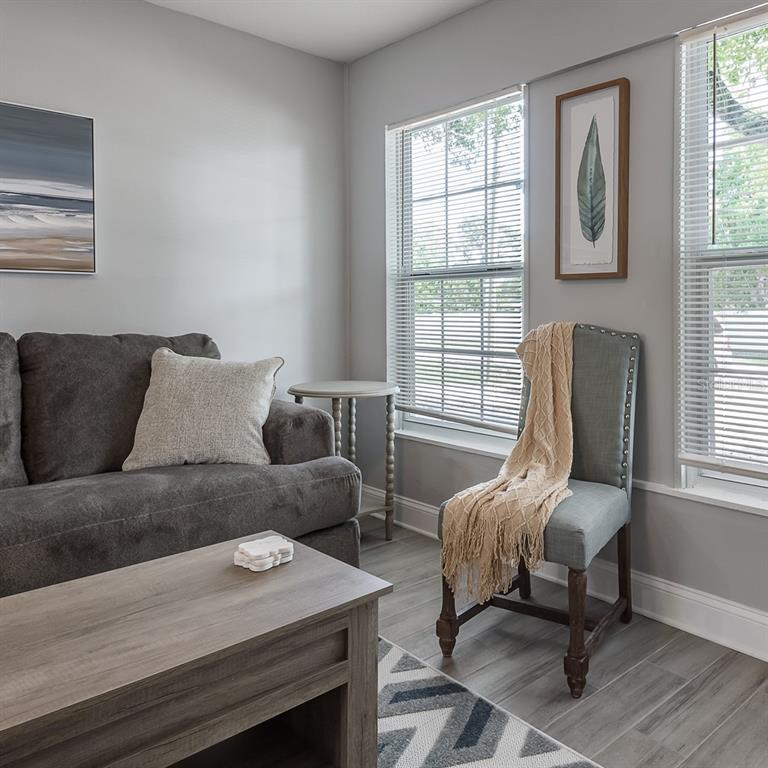 15732 Bolesta Road, Unit A Clearwater, FL 33760 - Photo 5 of 13 a living room with furniture and a window