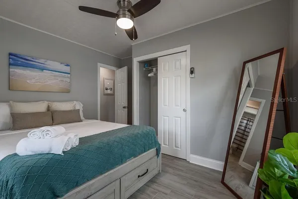 a bedroom with a bed and a window