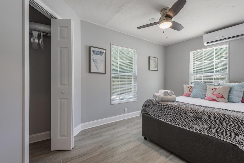 15732 Bolesta Road, Unit A Clearwater, FL 33760 - Photo 9 of 13 a room with a bed and a window