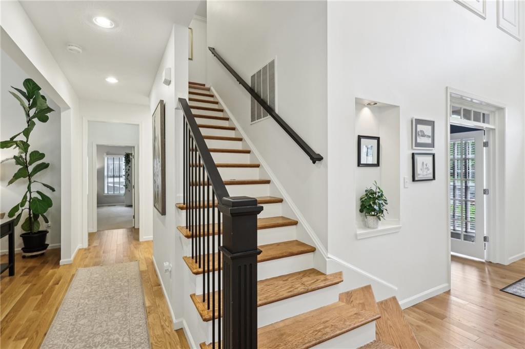 319 Buffalo Ridge Road Peters Township, PA 15317 - Photo 11 of 47 Staircase to 2nd floor. Notice the Solid White Oak Floors throughout the main level. Display your favorite artwork in the Niche with downlighting,