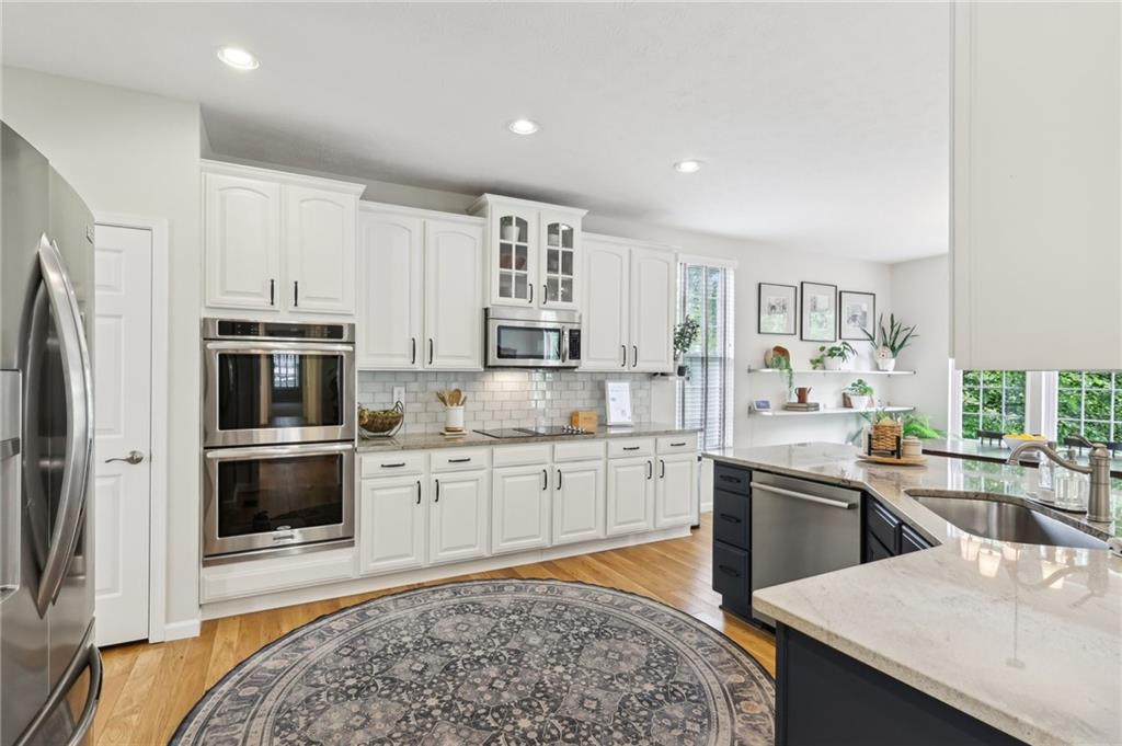 319 Buffalo Ridge Road Peters Township, PA 15317 - Photo 19 of 47 Spacious kitchen with tons of cabinets, pantry, double convection oven, stainless steel appliances, gorgeous neutral granite counters, recessed lighting and tons of natural light.