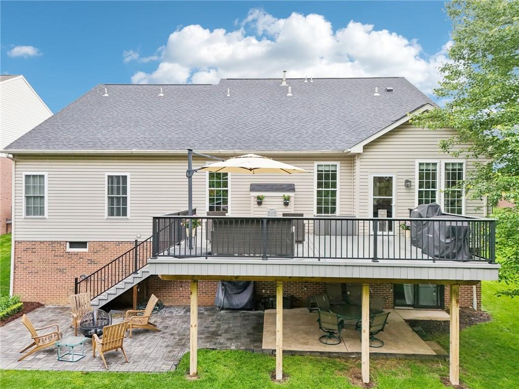319 Buffalo Ridge Road Peters Township, PA 15317 - Photo 2 of 47 Entertain on the Huge Trex Deck and then sit by the fire on the patio below while enjoying the lush wooded view.