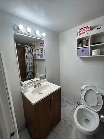 a bedroom with a bed and a table in it