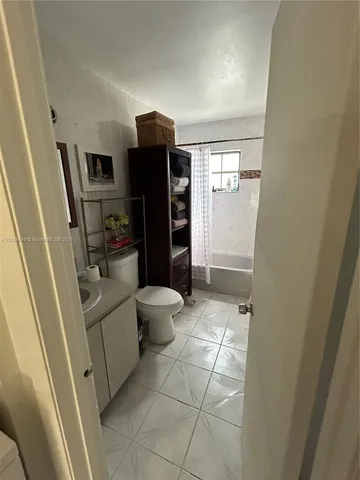 a bedroom with a bed and walk in closet