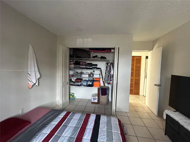 a living room with a fireplace and a large window